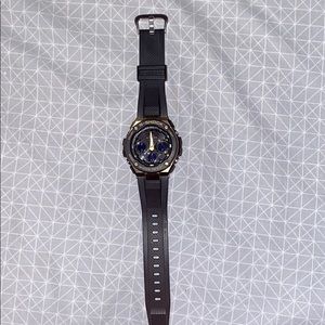 Black/Gold Casio G-SHOCK sport watch.